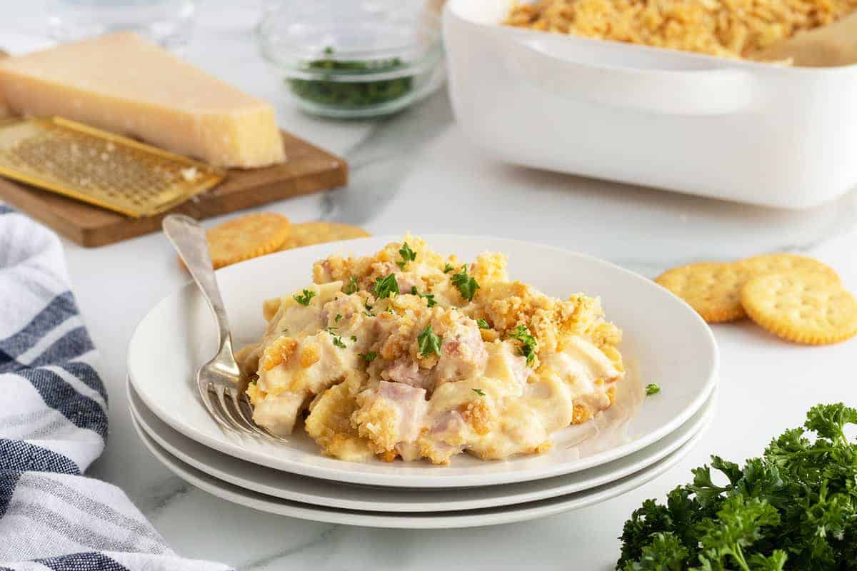 Chicken casserole with ham, cheese, and creamy sauce.