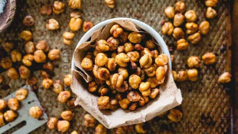 Roasted chickpeas coated in cinnamon and sugar, baked until golden and crunchy, served as a sweet snack.