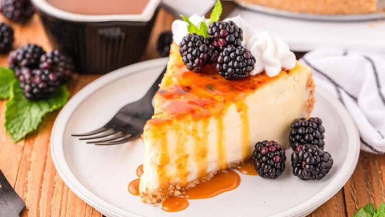 Golden-topped crème brûlée cheesecake with a caramelized sugar crust and creamy cheesecake filling.