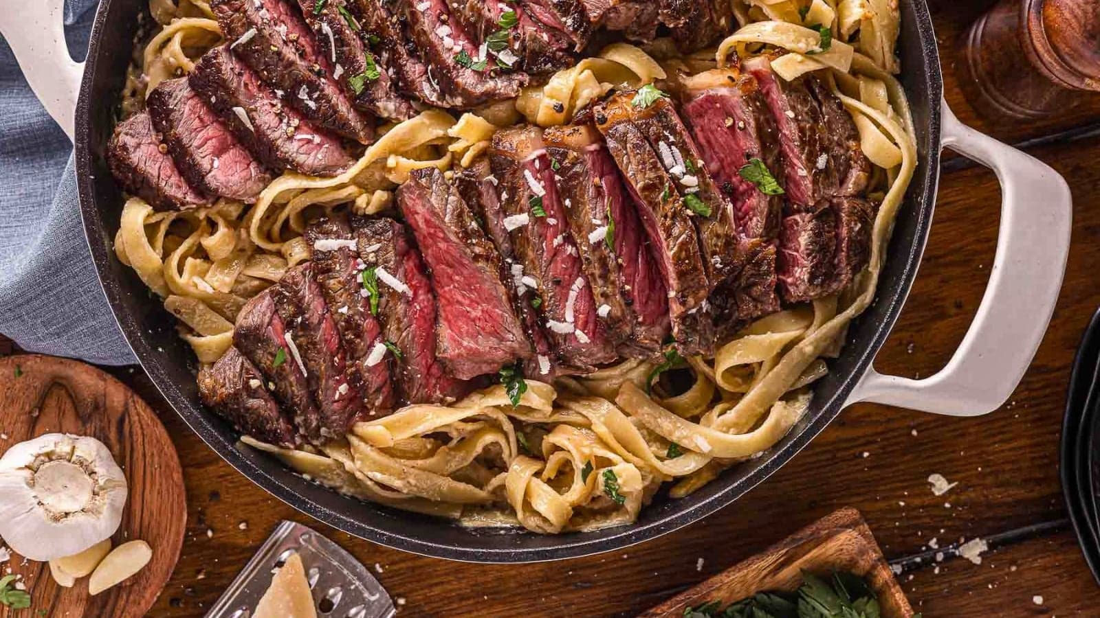 Creamy Alfredo pasta topped with seared steak.