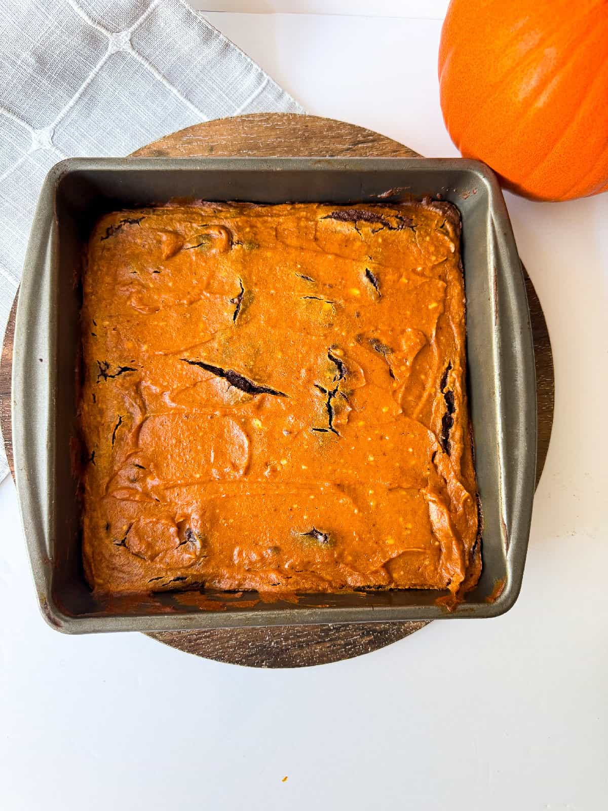 Freshly baked pumpkin brownies cooling in the pan straight from the oven.