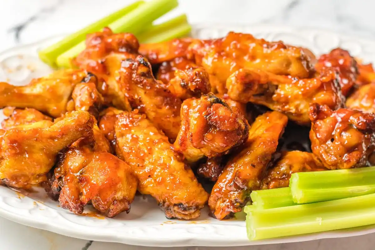 Chicken wings glazed with BBQ peach-bourbon sauce, air-fried.