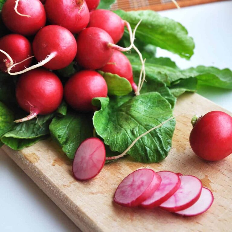 Crisp radishes displayed on a cutting board.