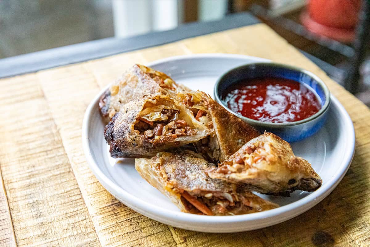 Crispy fried egg rolls stuffed with seasoned pork and cabbage.