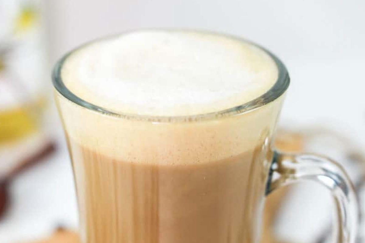 Starbucks vanilla latte in a tall cup.