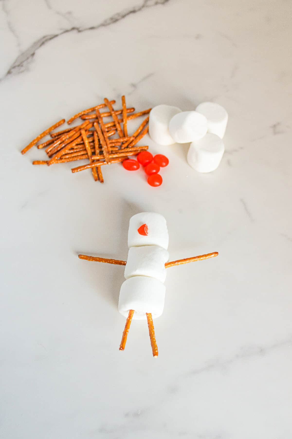 A red jelly bean added as the snowman's nose.