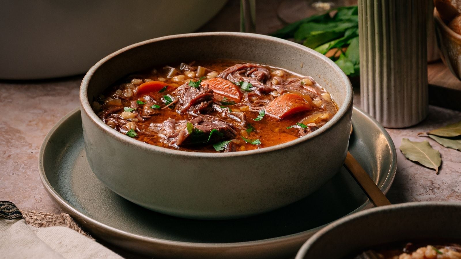 Hearty beef and barley soup, slow-cooked.