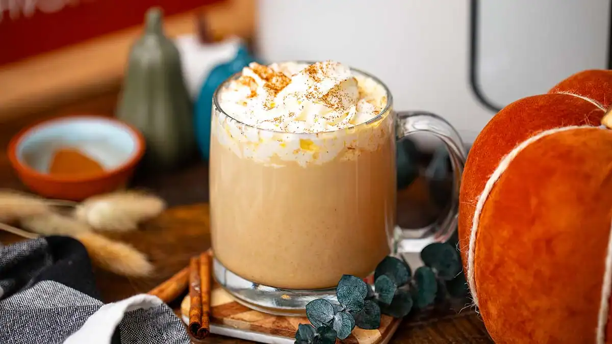Pumpkin spice latte topped with whipped cream.
