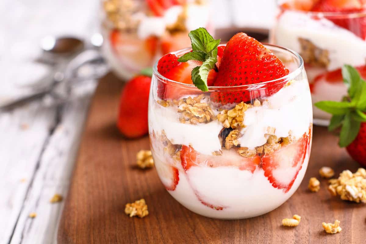 A colorful assortment of fruits, vegetables, dairy, grains, and proteins representing the components of a balanced diet.