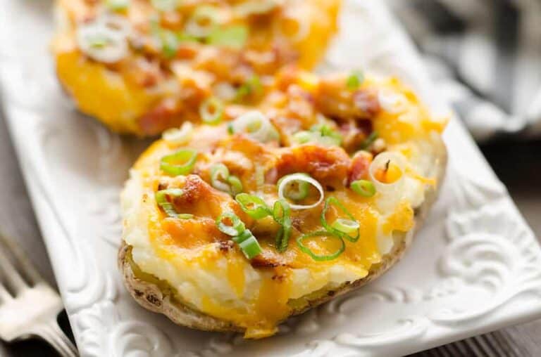 Crispy twice-baked potatoes stuffed with ham and melted cheese.