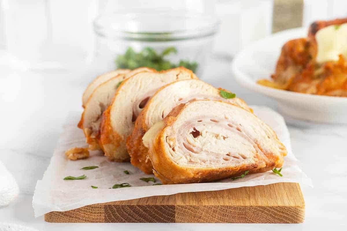 Classic stuffed chicken with ham, Swiss cheese, and a crispy crust.