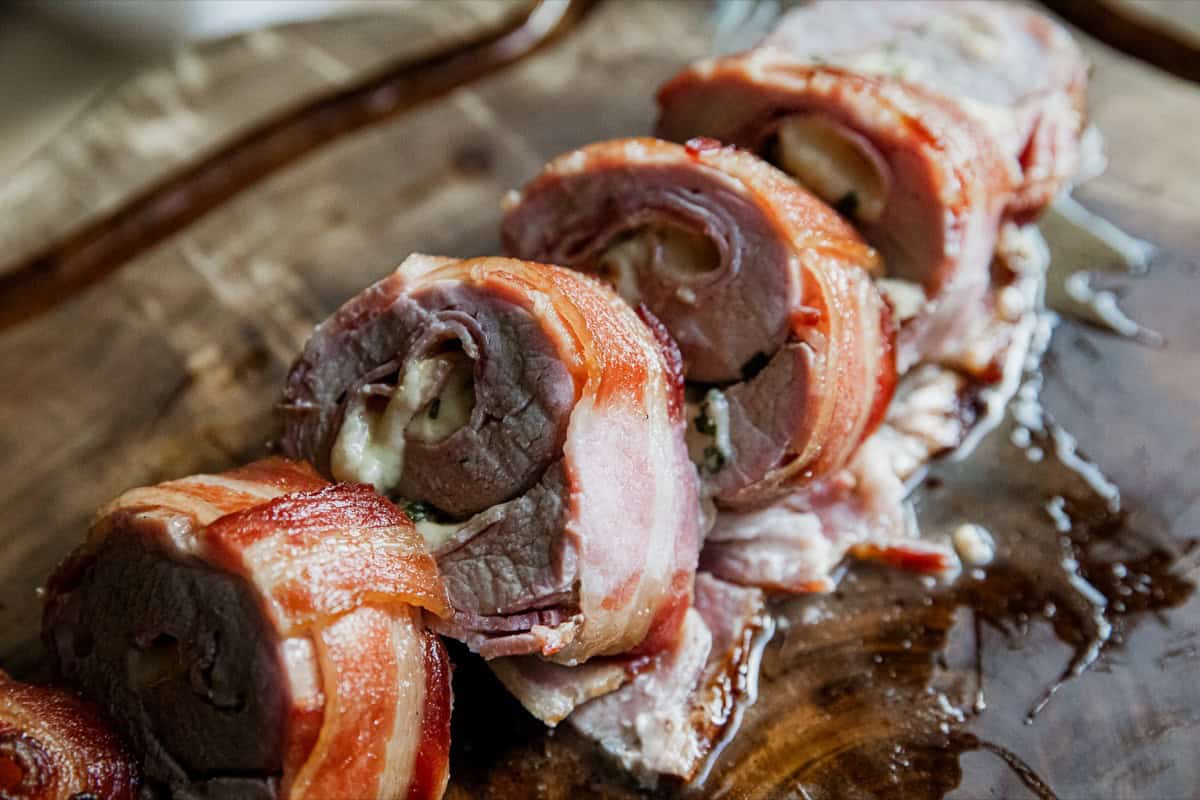 Pork wrapped in bacon with melty cheese and smoky flavor.