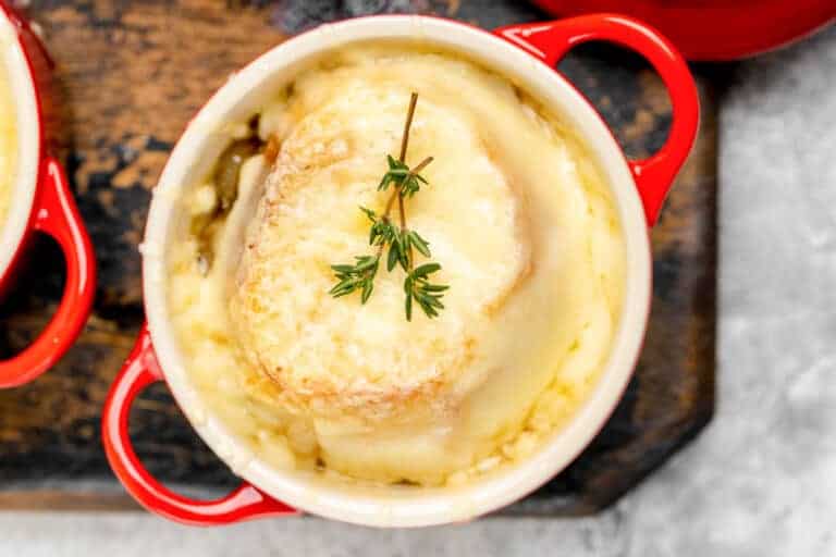Classic French onion soup topped with melted cheese and toasted bread.