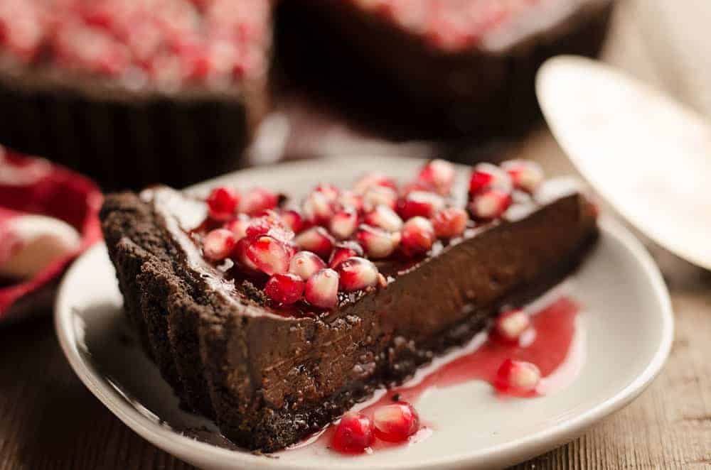 Dark chocolate tart topped with fresh pomegranate and sea salt.