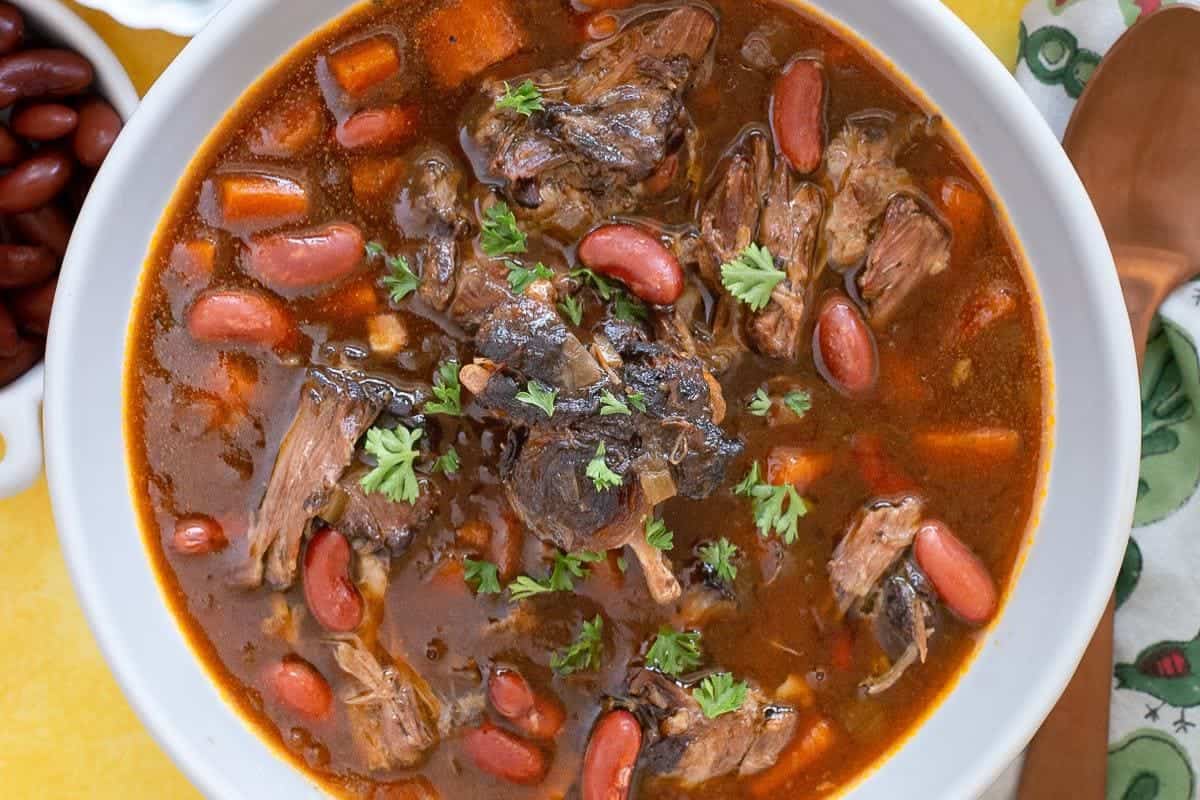 Slow-cooked oxtails in rich, spiced Caribbean sauce.