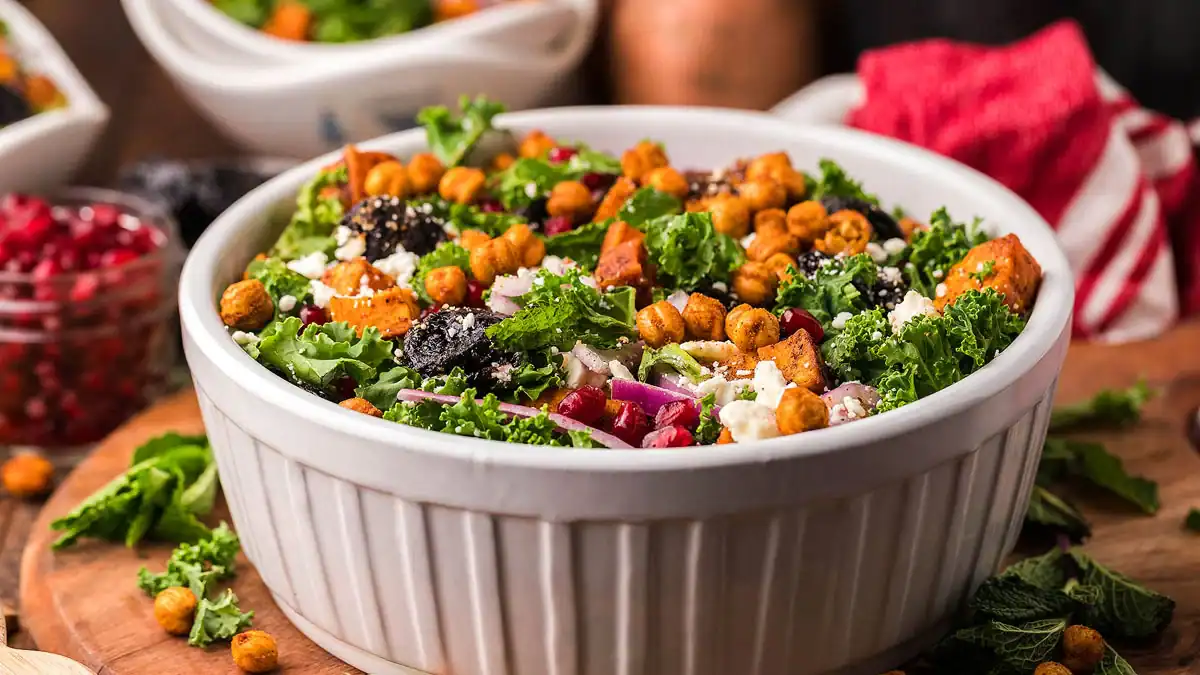 Tender roasted sweet potatoes mixed with kale and a simple dressing.