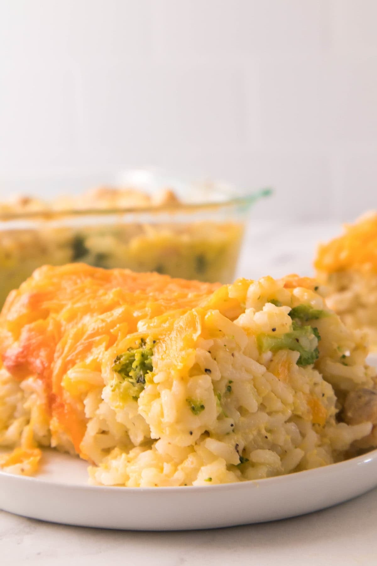 Comforting cheesy chicken broccoli rice dinner served fresh from the baking dish.