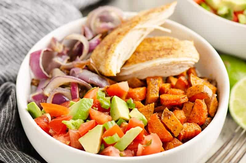 Chipotle chicken served over roasted root vegetables.