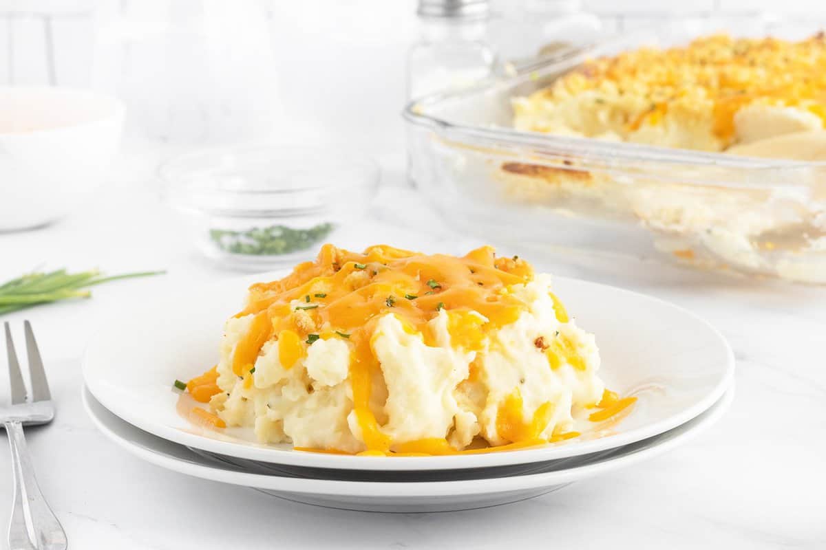 Creamy baked potato casserole topped with cheese.