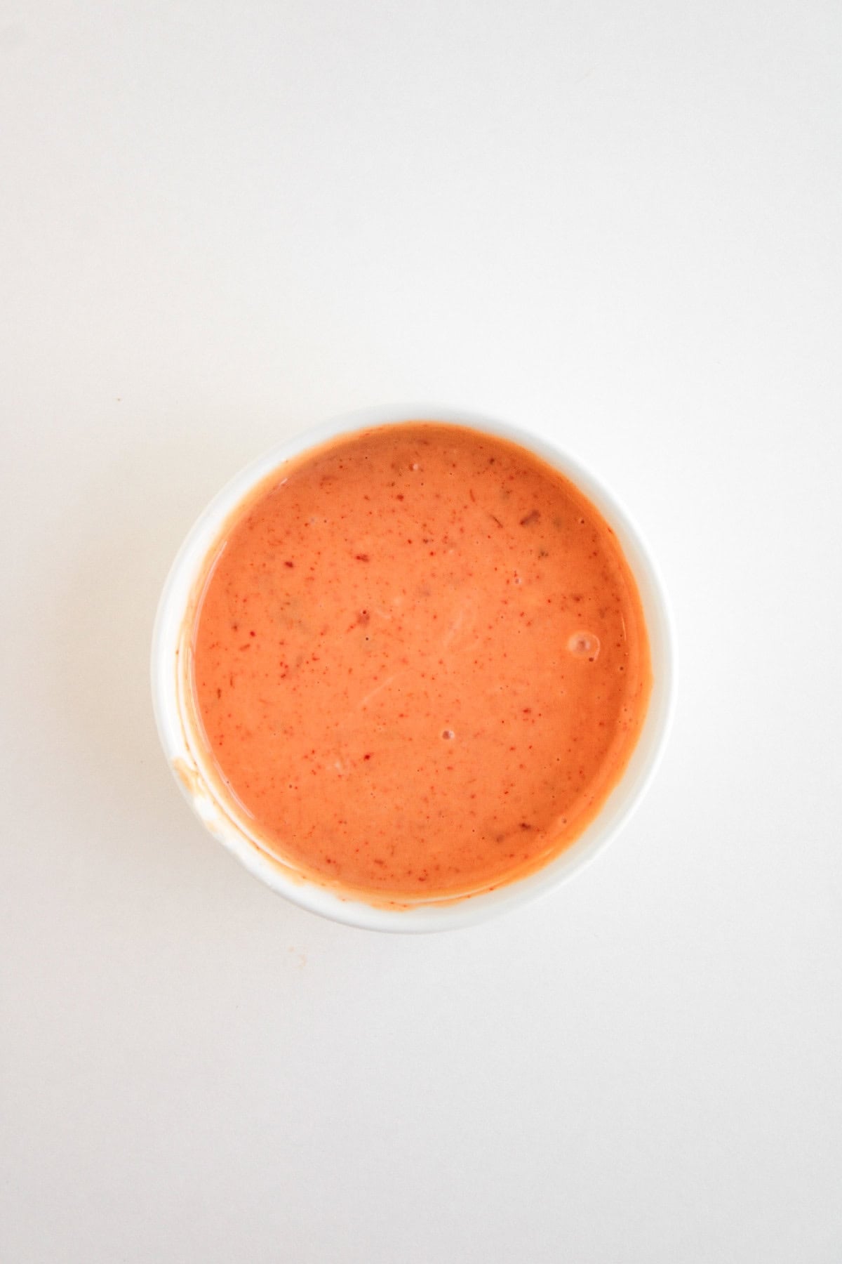 Creamy bang bang sauce mixed in a small bowl.