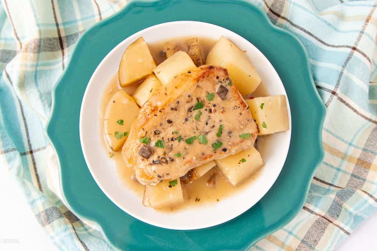 Pork chops and potatoes cooked together in the slow cooker.
