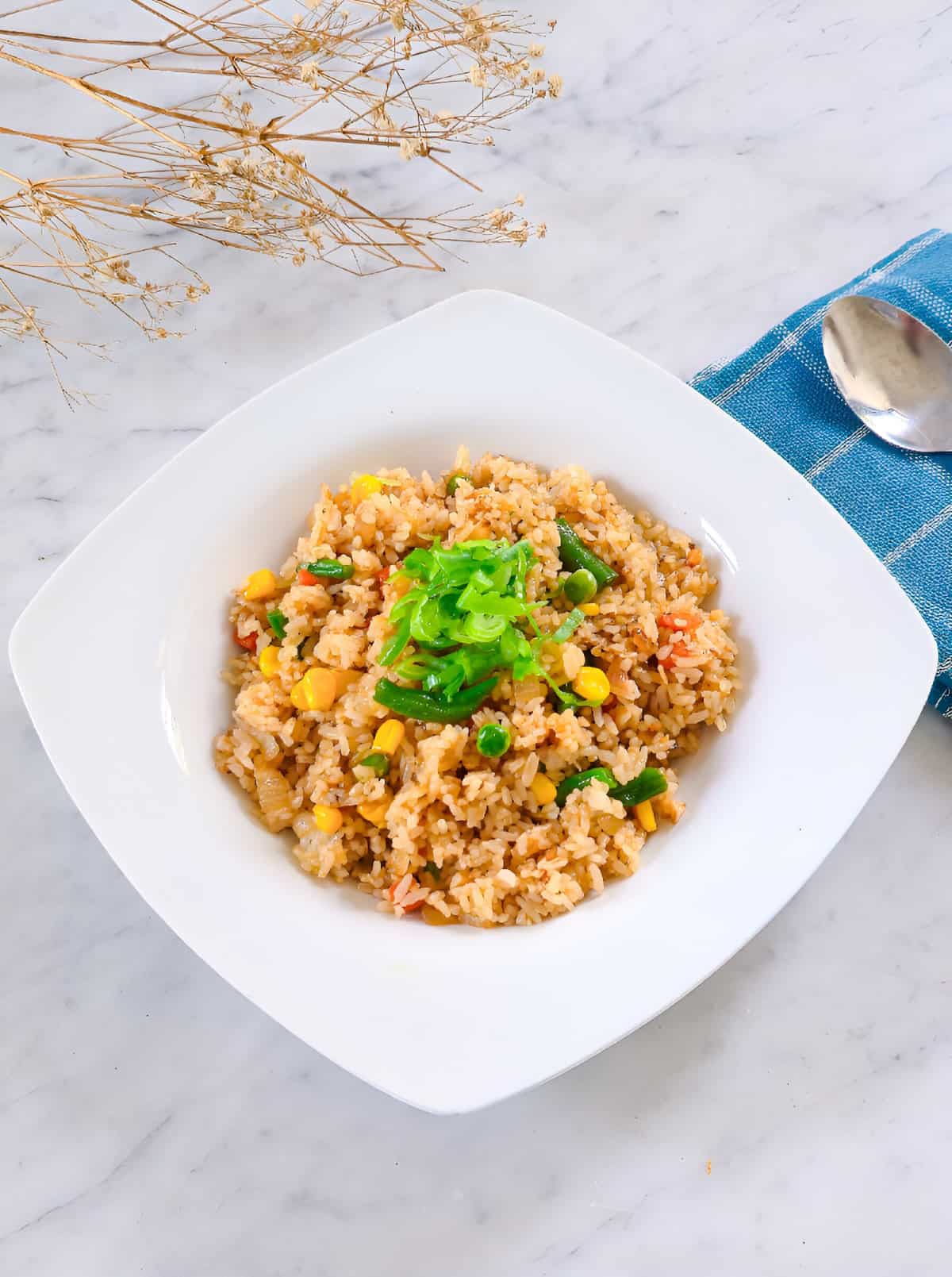 Easy frozen vegetable fried rice served warm with colorful mixed vegetables.