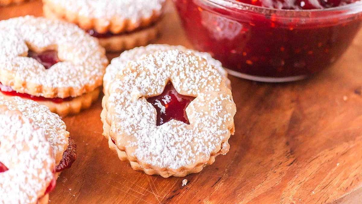 Linzer cookies with powdered sugar and jam centers.
