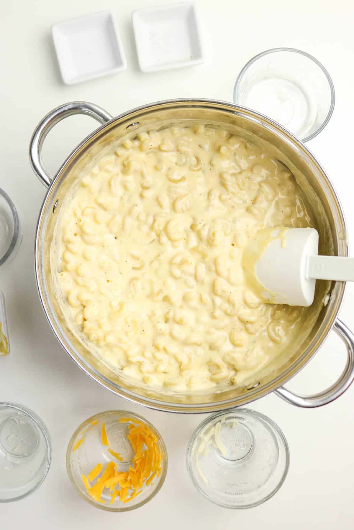 Macaroni stirred with three-cheese sauce until fully coated and creamy.