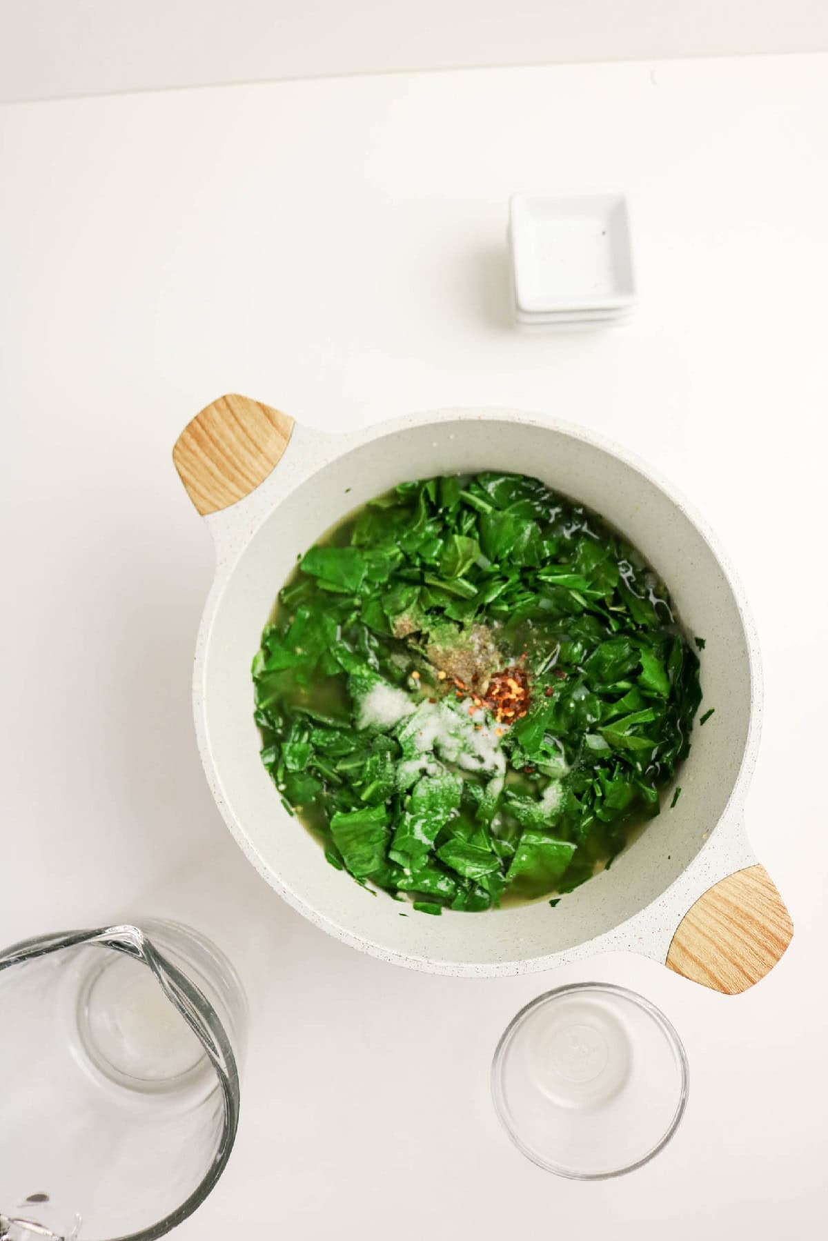 Seasoned collard greens simmering in broth.