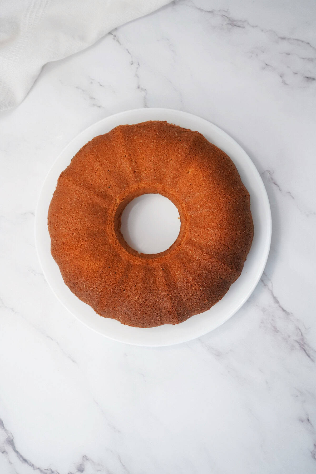 Easter bundt cake removed from the pan and placed on a serving plate.