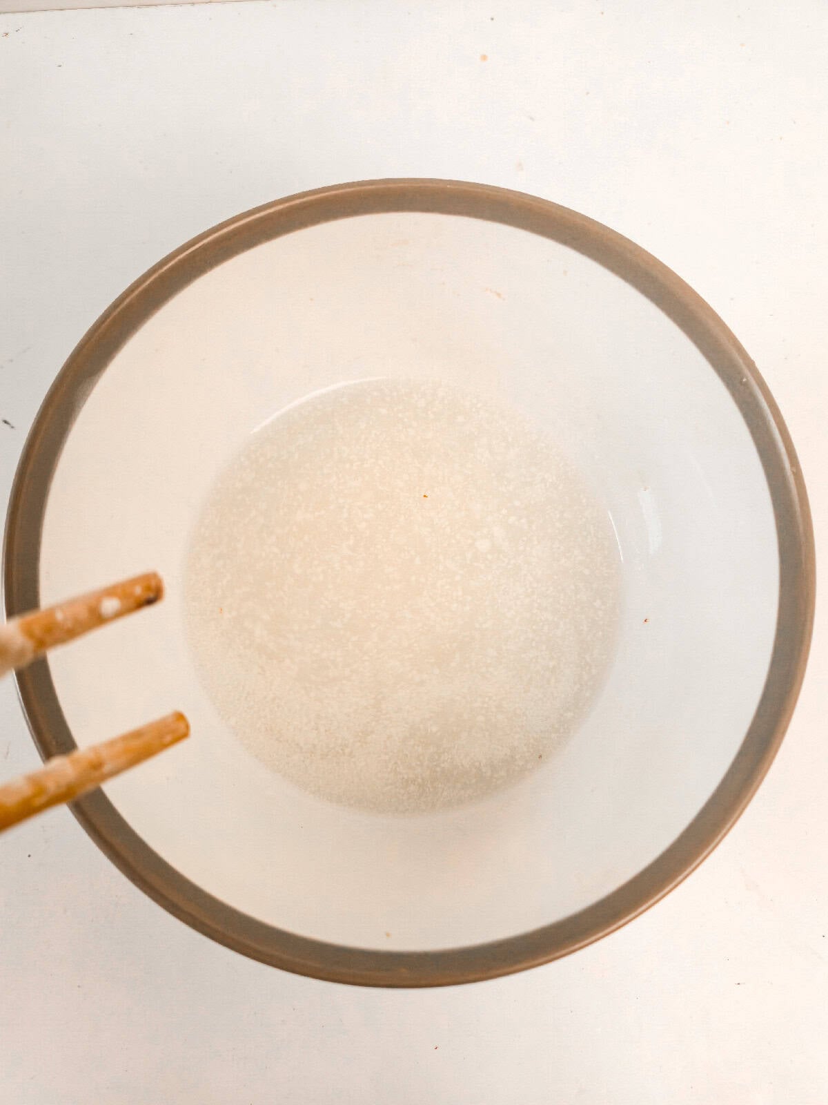 Water and mayo mixed in a bowl until lightly combined.