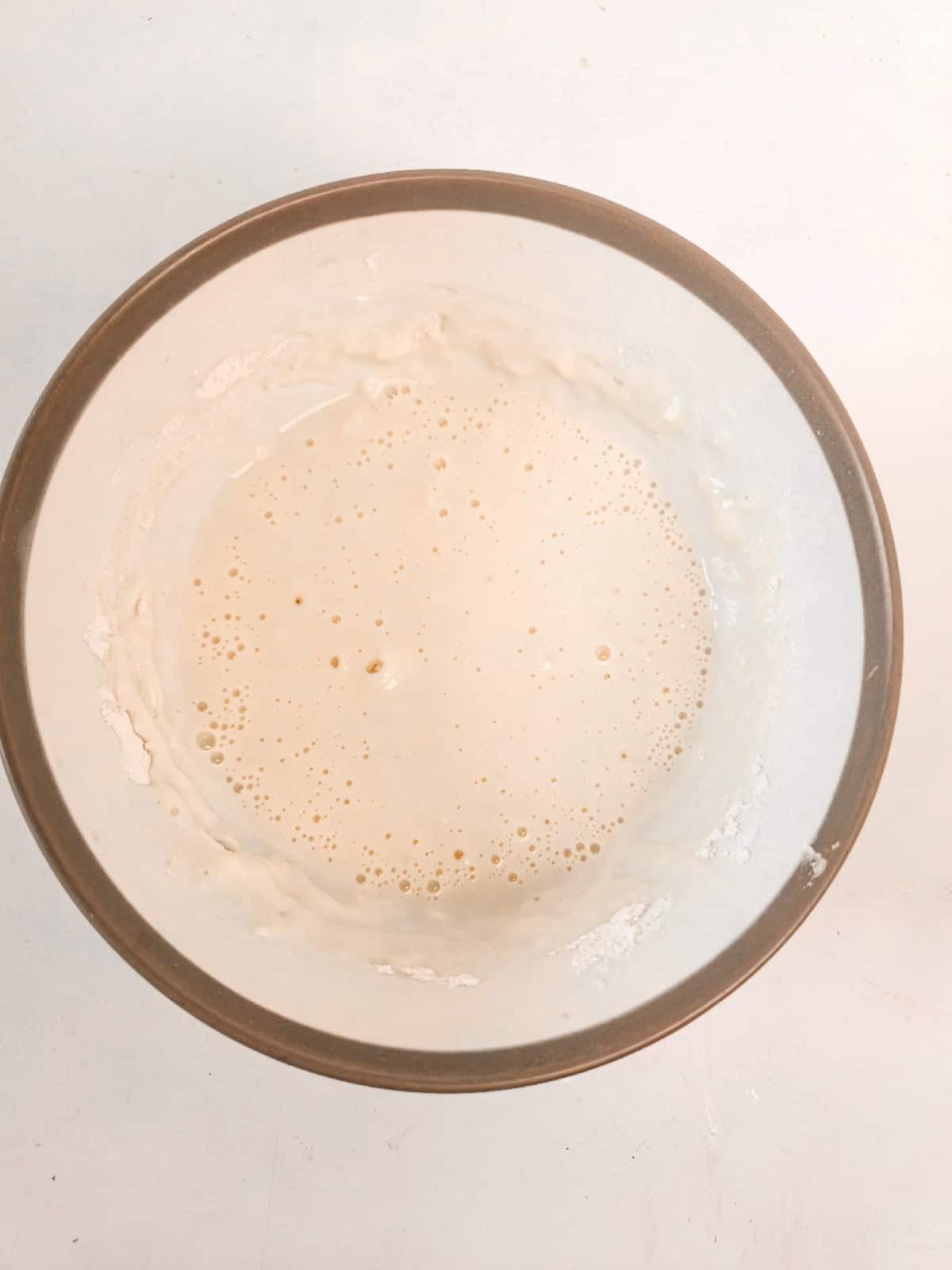 Tempura batter mixed in a bowl until lightly combined.
