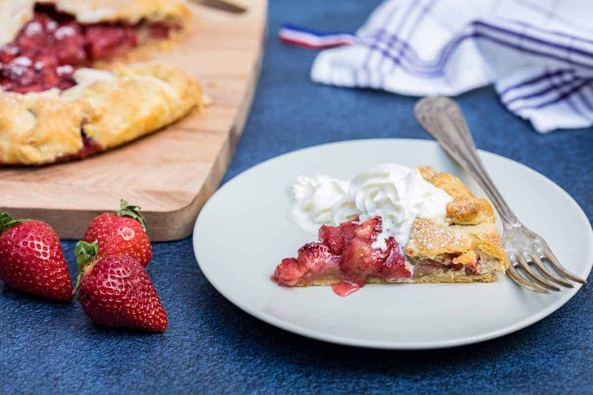 Rustic baked strawberry galette with flaky crust.
