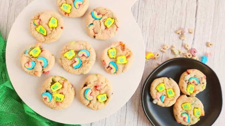 A plate of lucky charms cookies on the table.