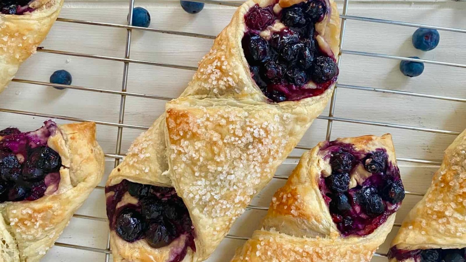 Flaky blueberry cheese Danish filled with sweet berries and creamy cheese.