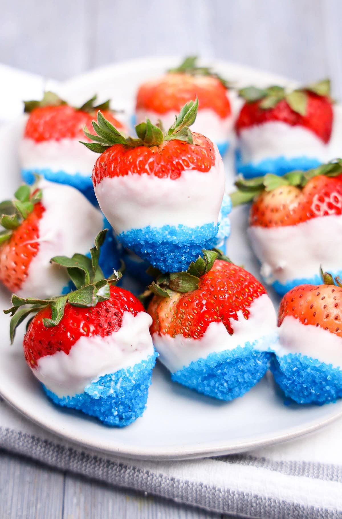 Patriotic chocolate dipped strawberries with blue sugar for July 4th dessert.