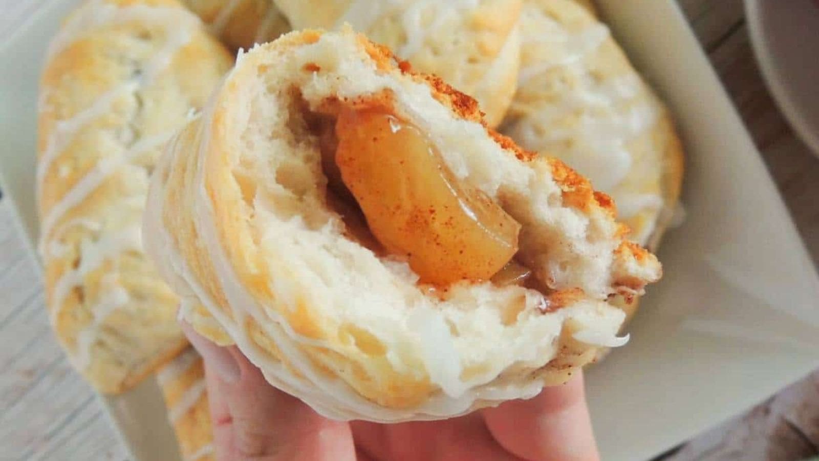 Flaky peach turnovers filled with sweet, juicy peaches and golden pastry layers.