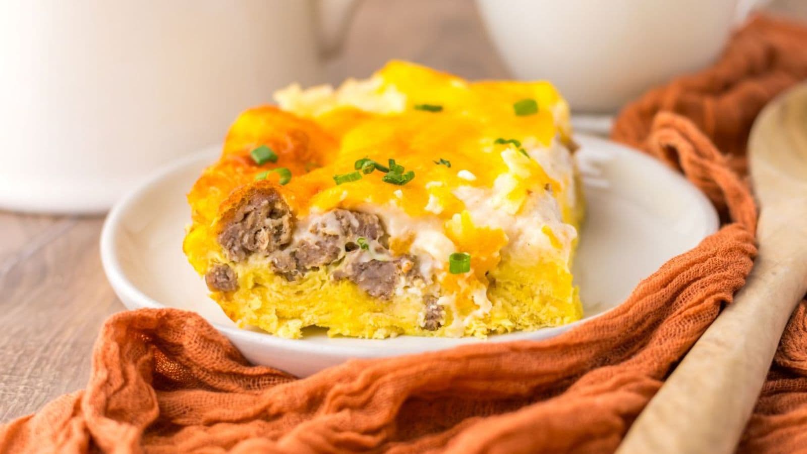 Sausage biscuits and gravy casserole with fluffy biscuits and creamy sausage gravy.