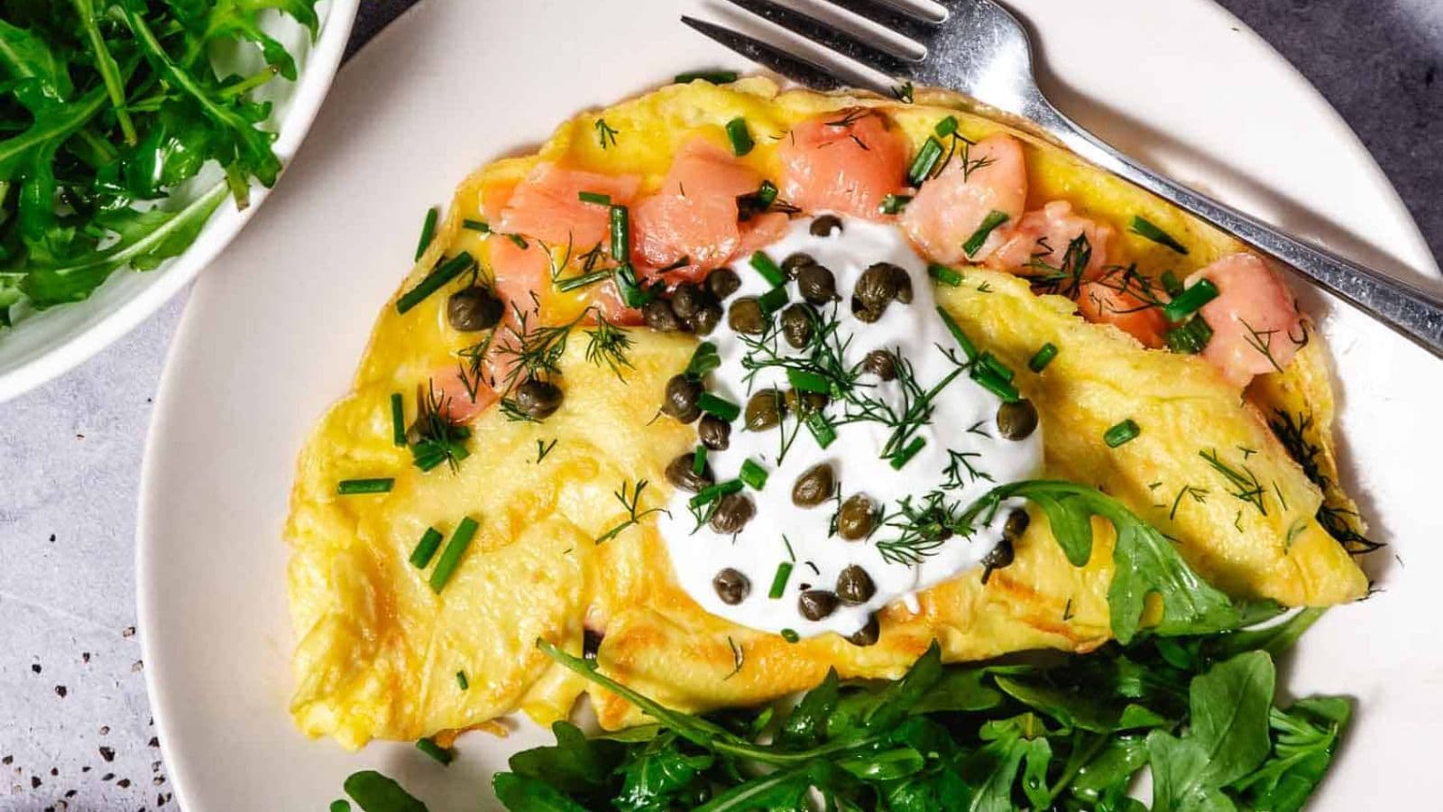 Smoked salmon omelet filled with tender eggs and slices of savory salmon.