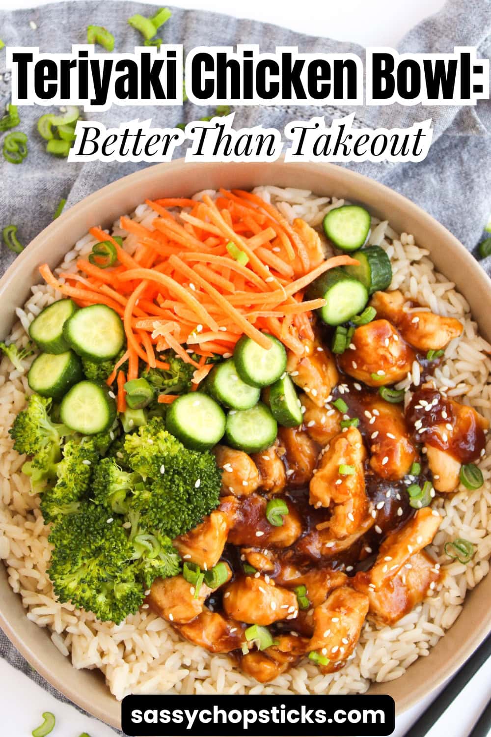 Teriyaki chicken rice bowl with broccoli, cucumber slices, shredded carrots, and sesame seeds.