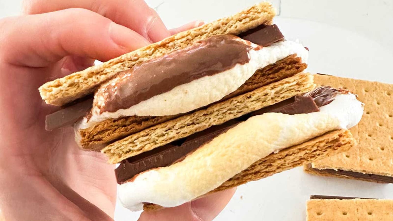S’mores made with toasted marshmallows, chocolate, and graham crackers.