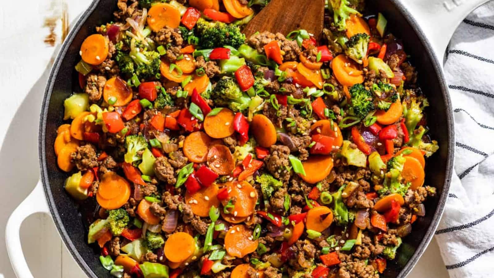 Ground beef stir fry cooked with vegetables in a glossy sauce.
