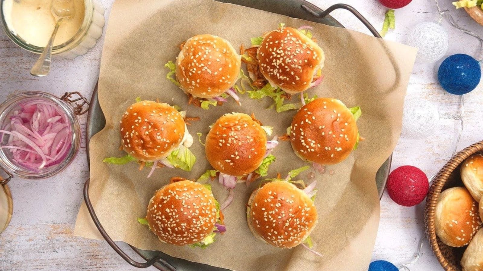 Pulled pork sliders stacked with tender meat on soft slider buns.