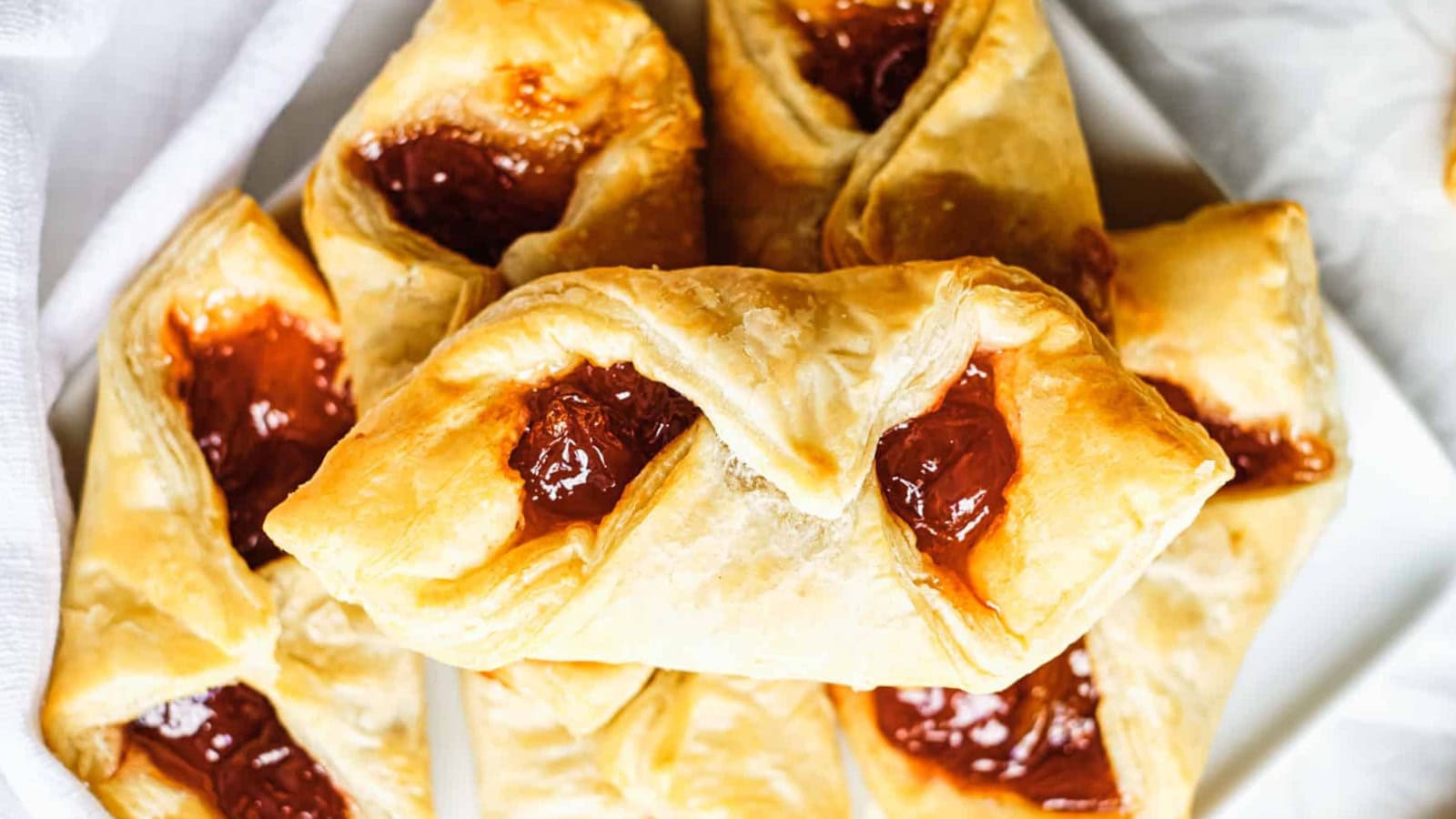 Puff pastry breakfast bites filled with eggs, cheese, and savory ingredients.