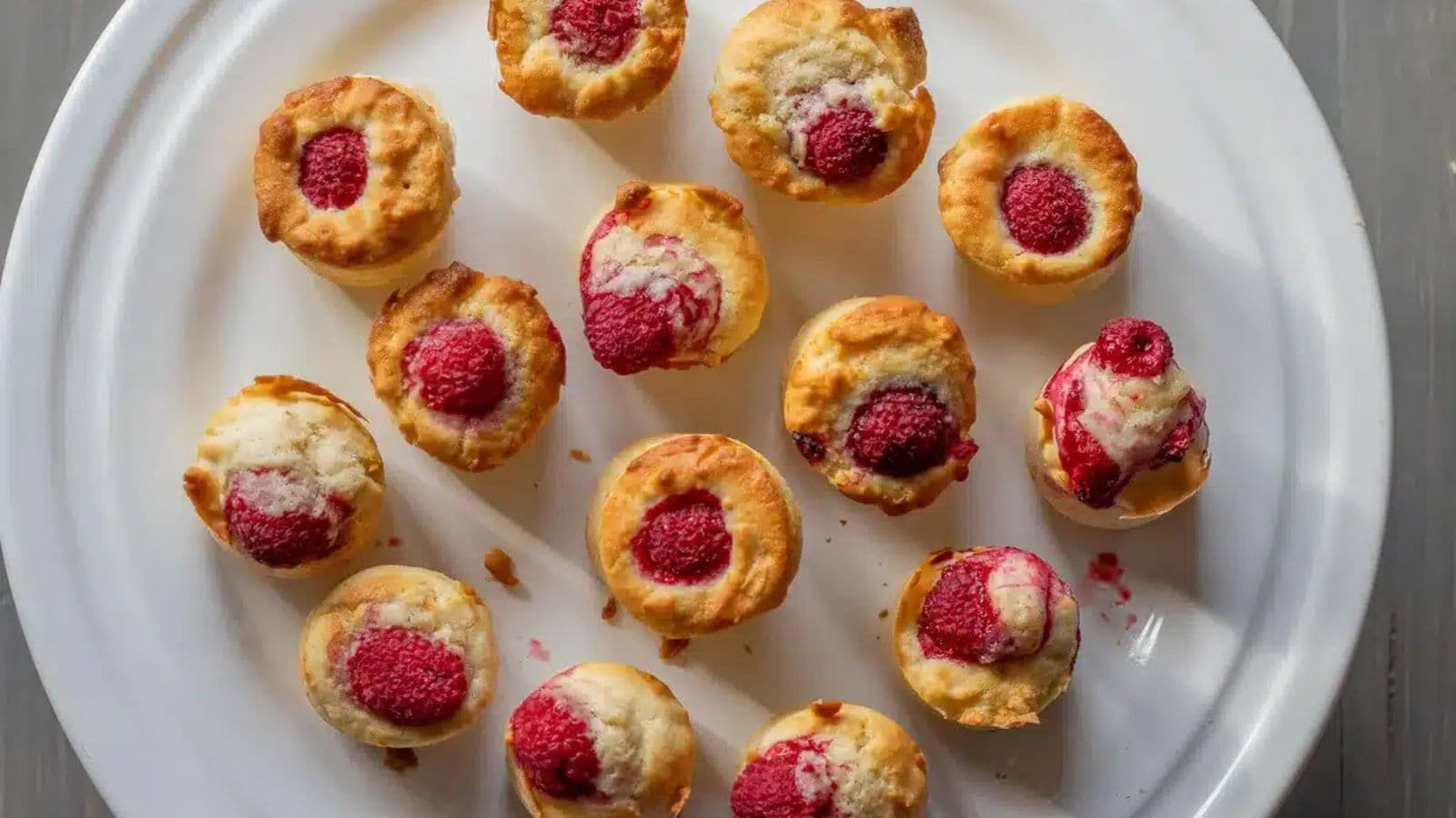 Raspberry muffins baked with white chocolate and soft fluffy texture.