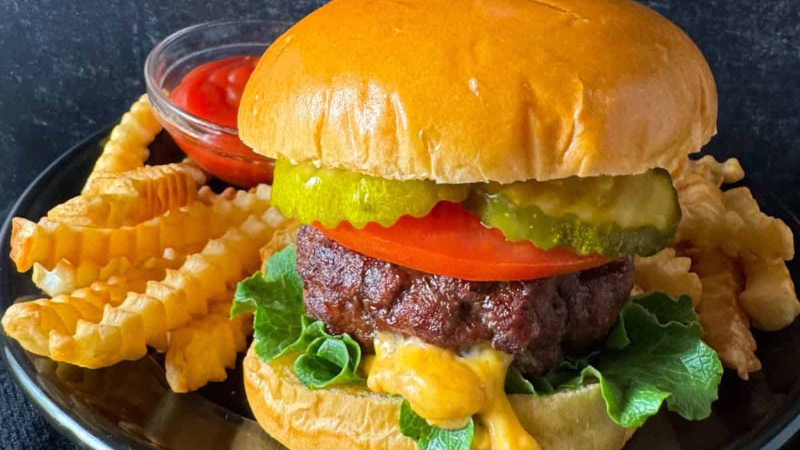 Air fryer burgers stuffed with melted cheese and cooked until juicy.