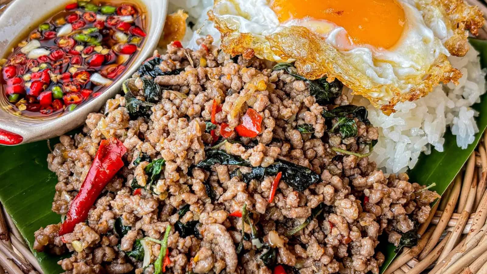 Thai basil beef cooked with savory sauce and fresh basil leaves.