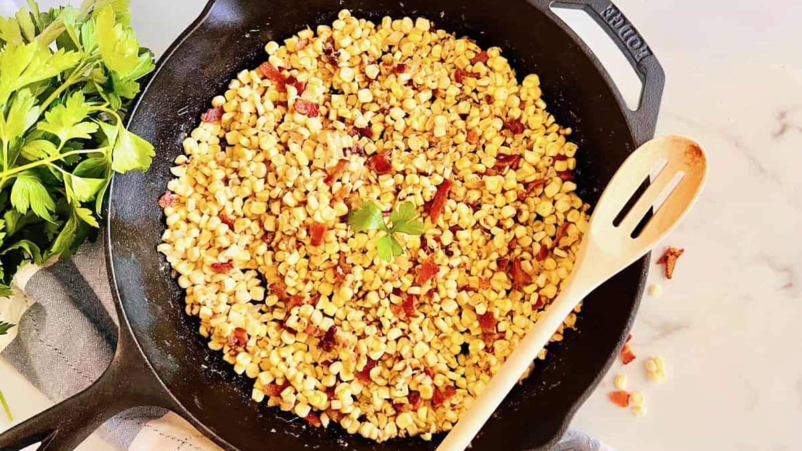 Fried corn cooked with crispy bacon and golden kernels.