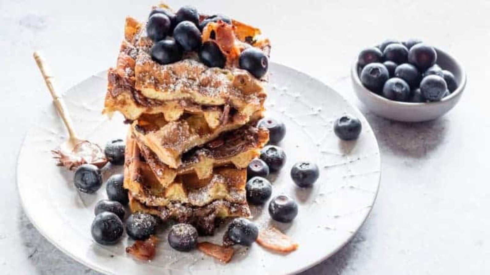 Waffles stuffed with Nutella and bacon with crispy golden texture.