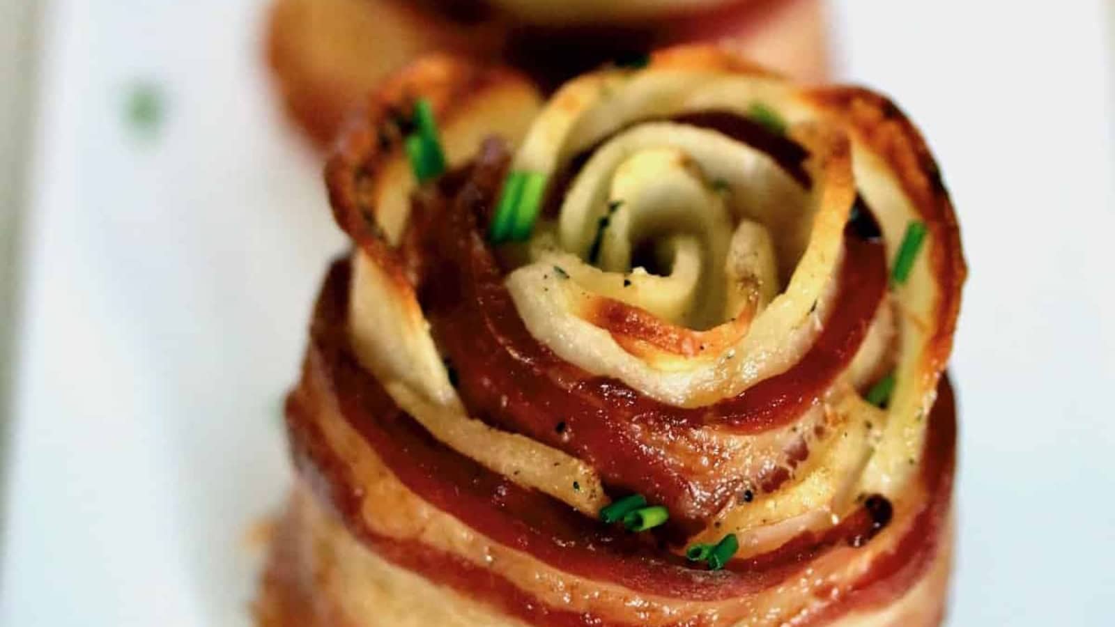 Potato roses wrapped with bacon and baked until crispy and golden.
